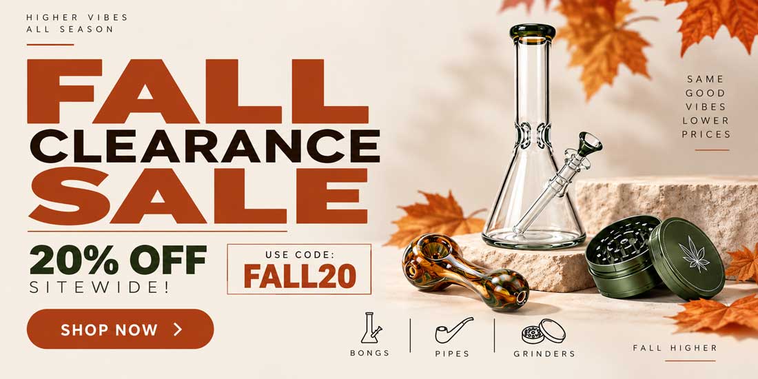Promotional sale banner for fall clearance with large orange and black text reading 'FALL CLEARANCE SALE' and '20% OFF SITEWIDE! USE CODE: FALL20'. The right side shows a clear glass bong, a brown glass rolling paper bag, and an olive green metal grinders set on a stone surface with autumn leaves.
